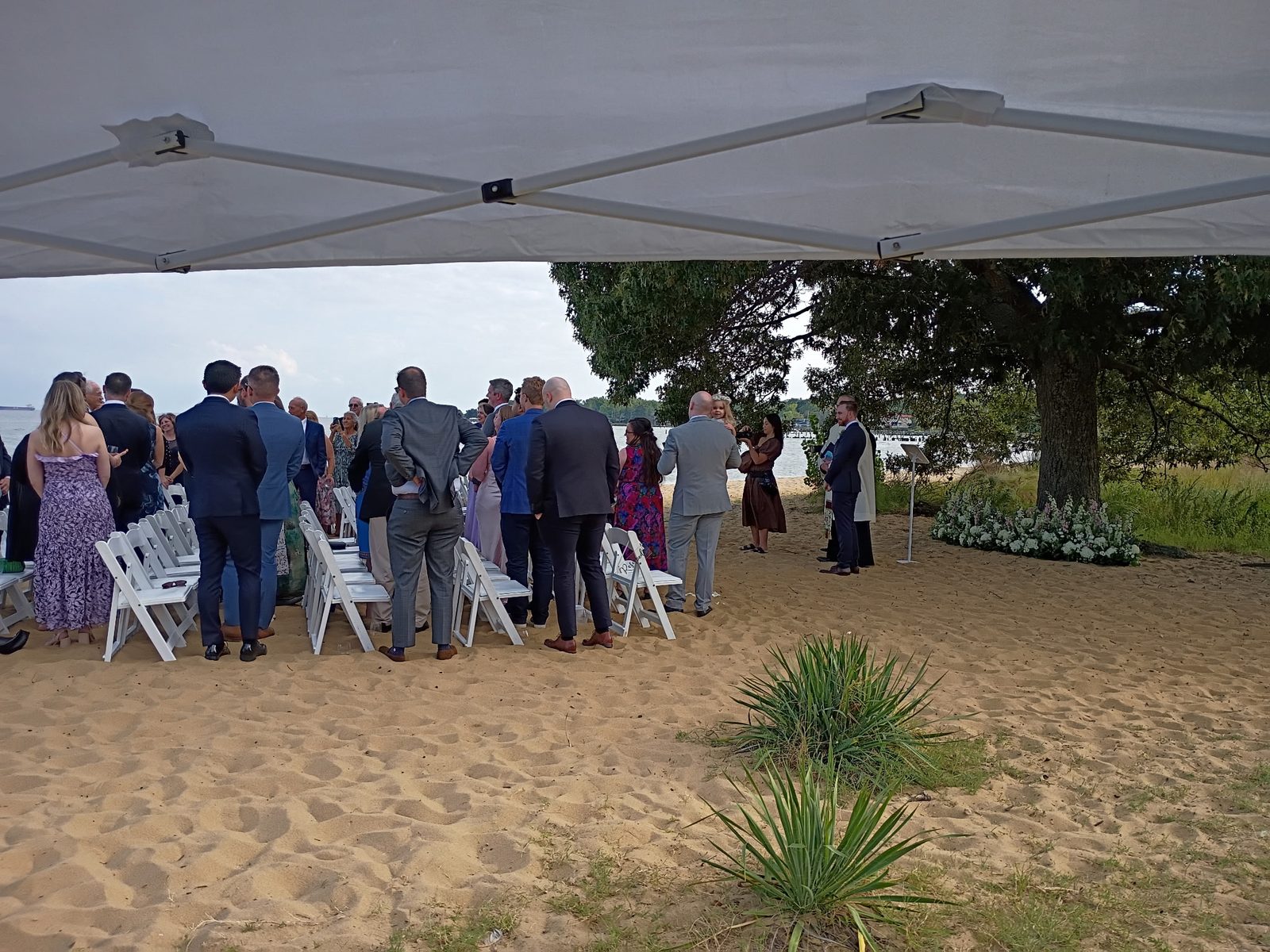 Guests gathered for a beach ceremony on the Chesapeake Bay at the Chesapeake Bay Foundation in Annapolis