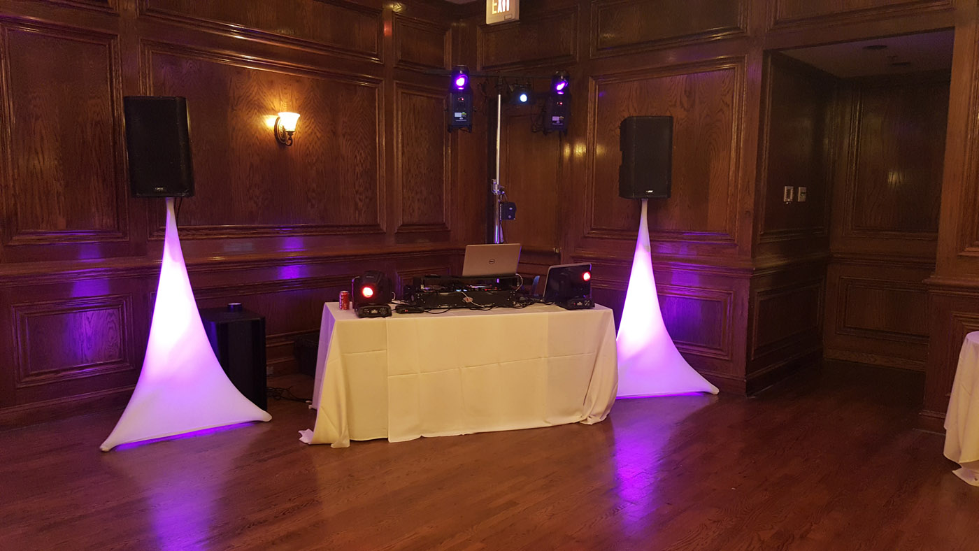 Elegant wedding reception with purple uplighting